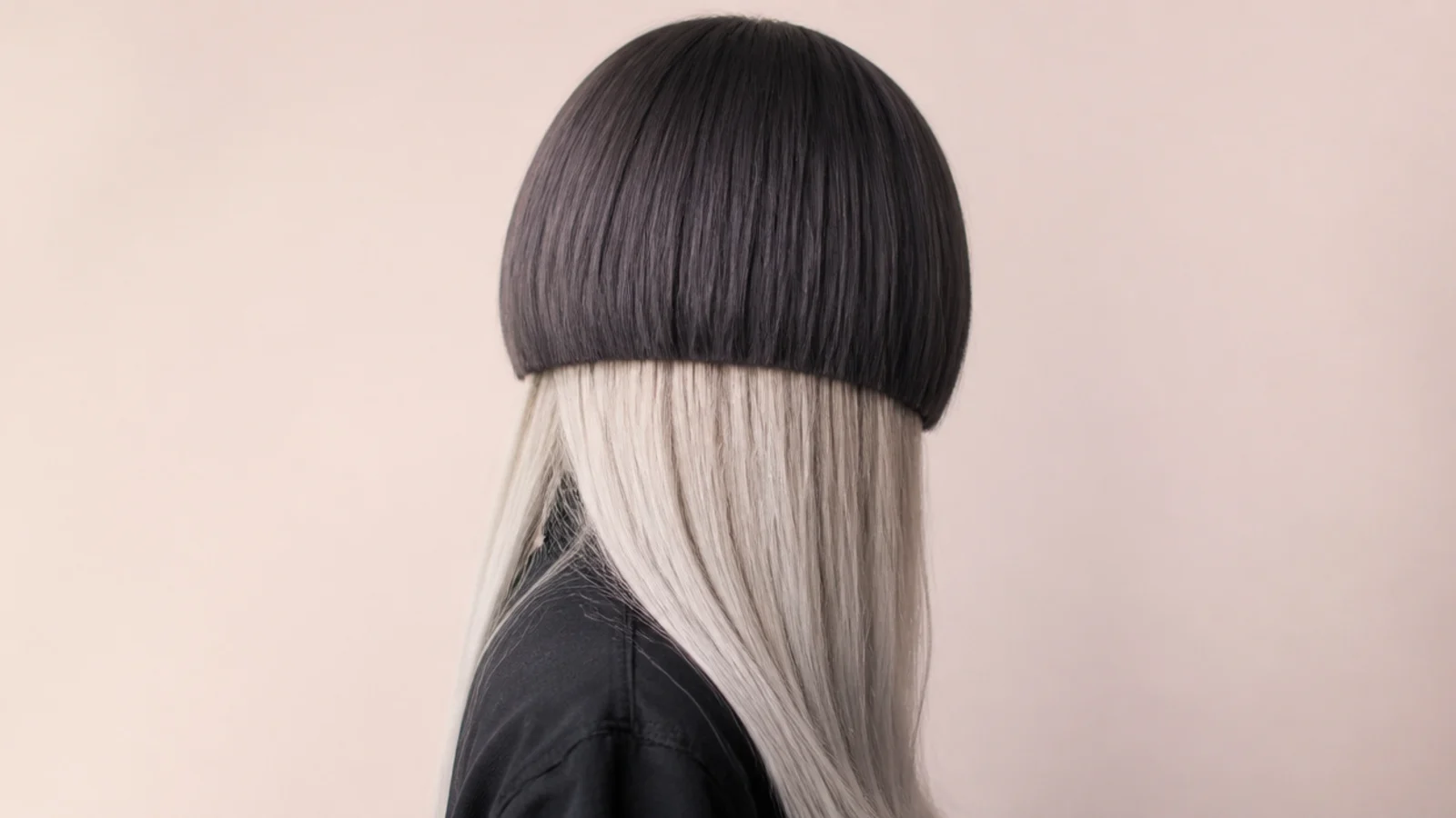 Ombre jellyfish haircut with a dark rounded bell fading into long silver disconnected lengths