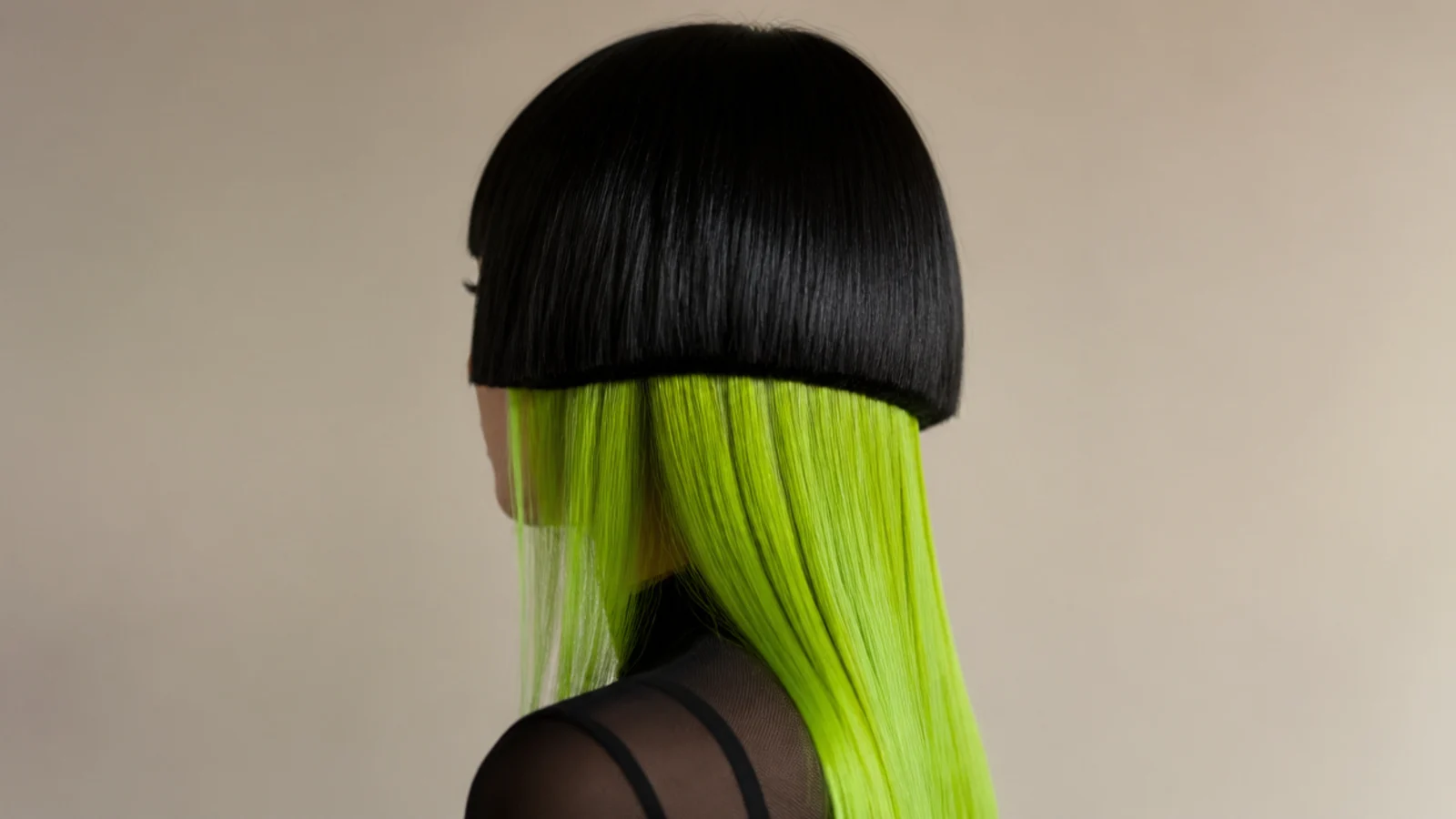 Jellyfish haircut with a black bowl-shaped bell over neon green long tentacle lengths