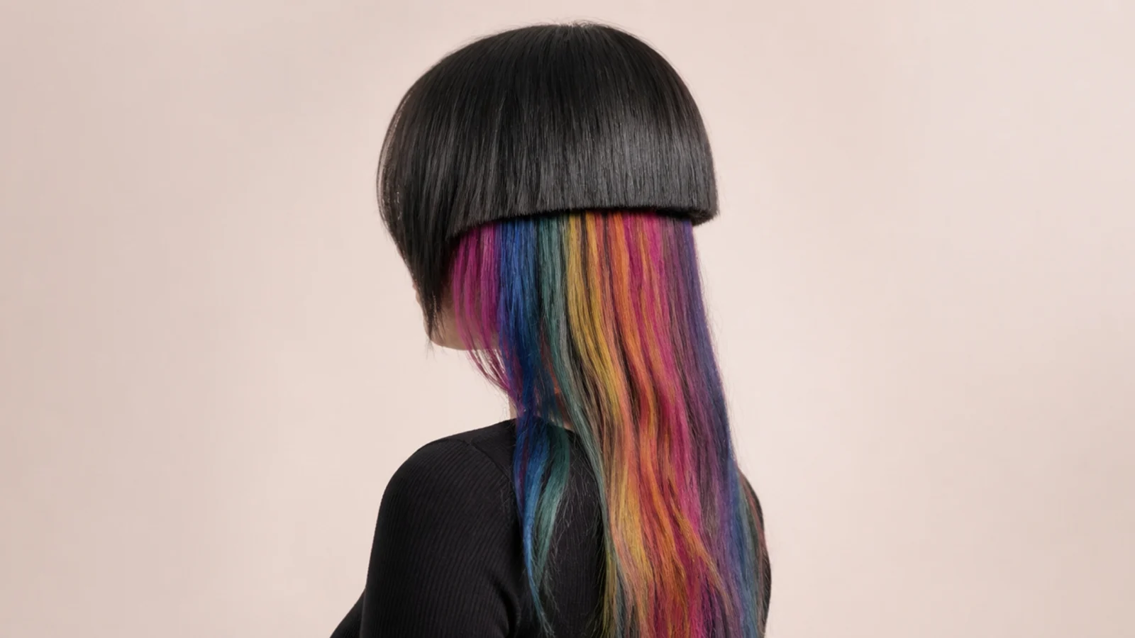 Jellyfish haircut with hidden rainbow peekaboo color on the long tentacle lengths underneath a dark bell