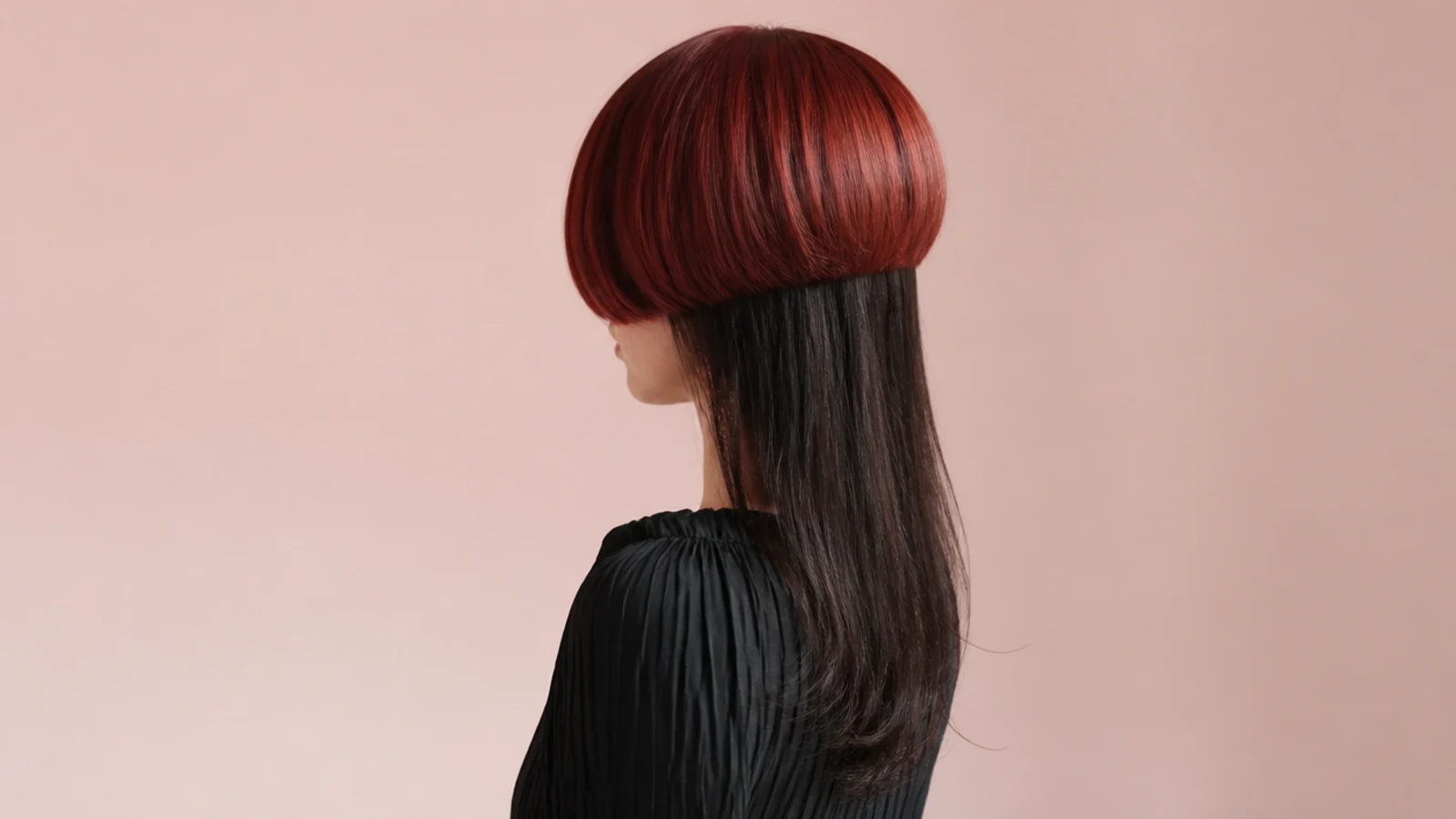 Cherry red bowl-shaped bell over espresso brown long lengths on a colored jellyfish haircut