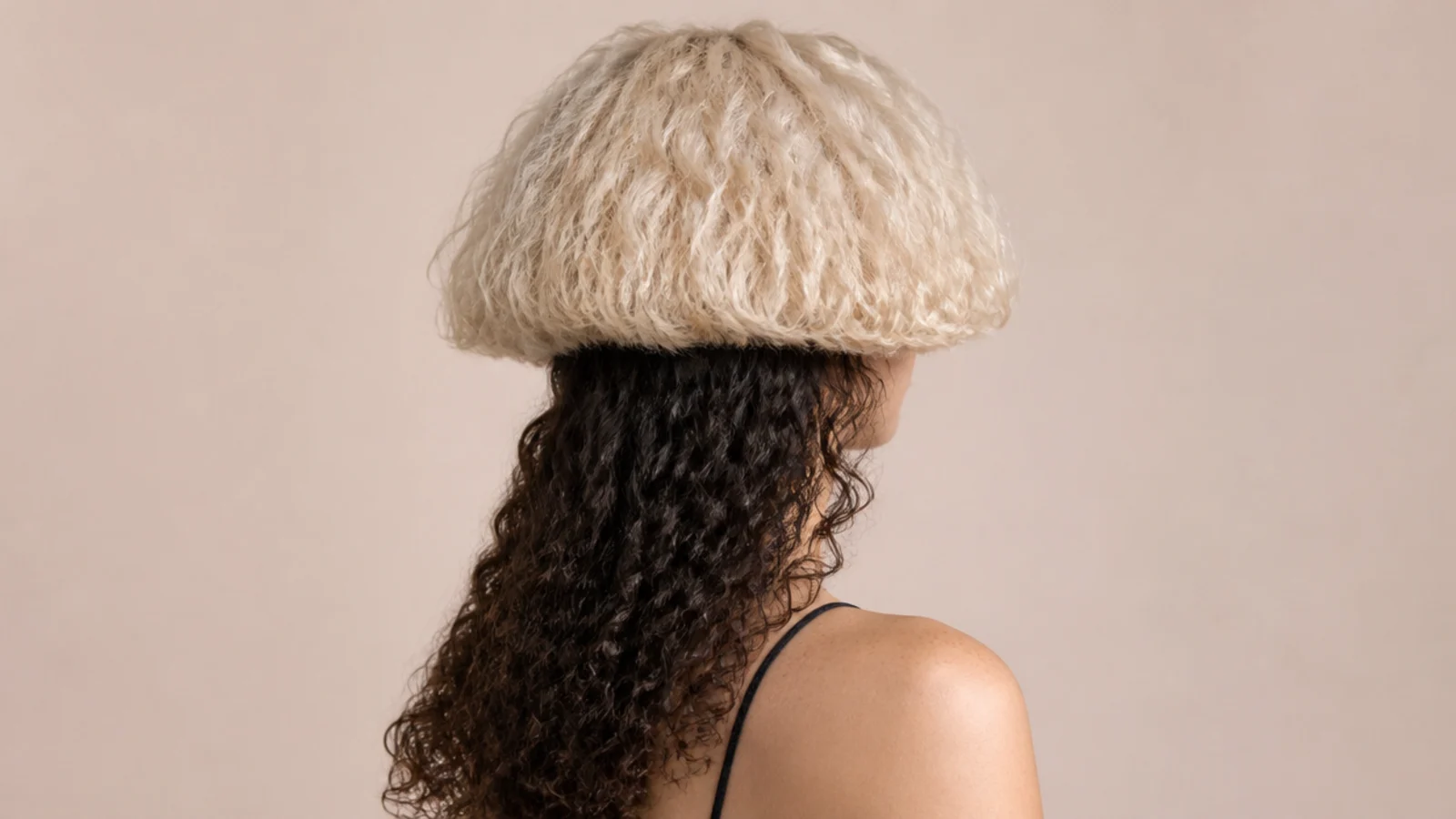 Two tone curly jellyfish haircut with a platinum blonde bell over dark brown long curly lengths