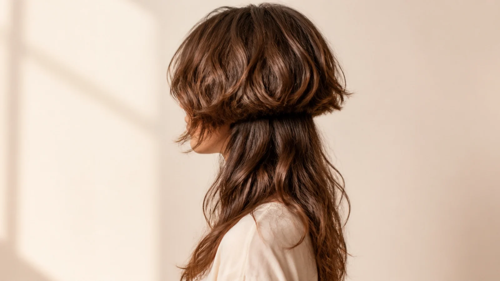 Curly jellyfish haircut on fine wavy hair with a lightweight bell and long soft wavy lengths