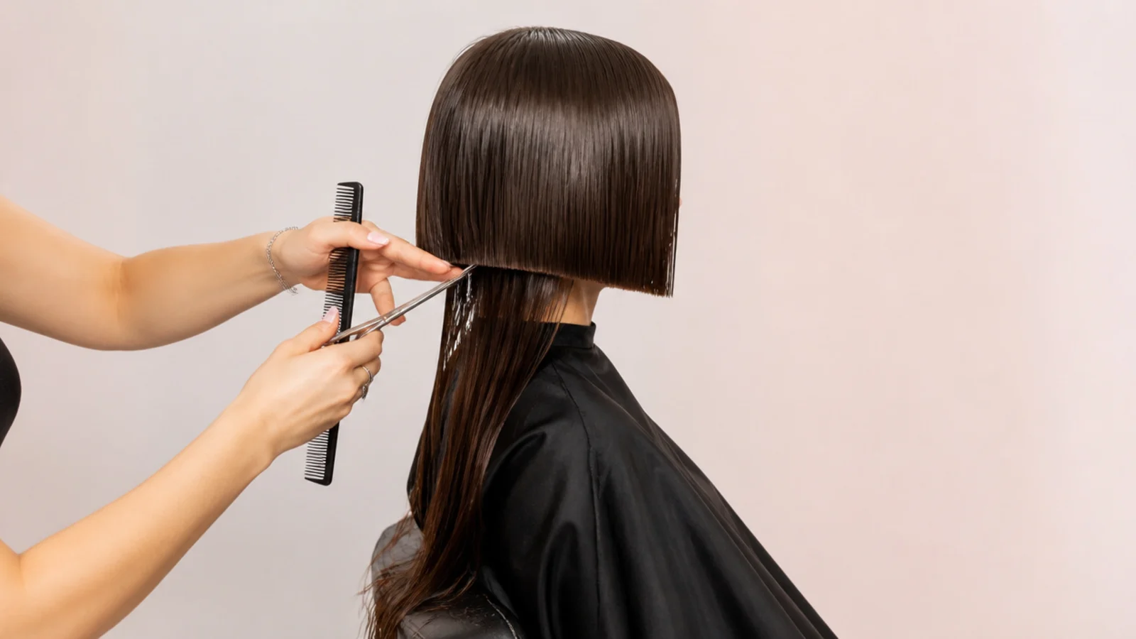 Cutting the front perimeter of a jellyfish haircut bell one inch below the target chin length