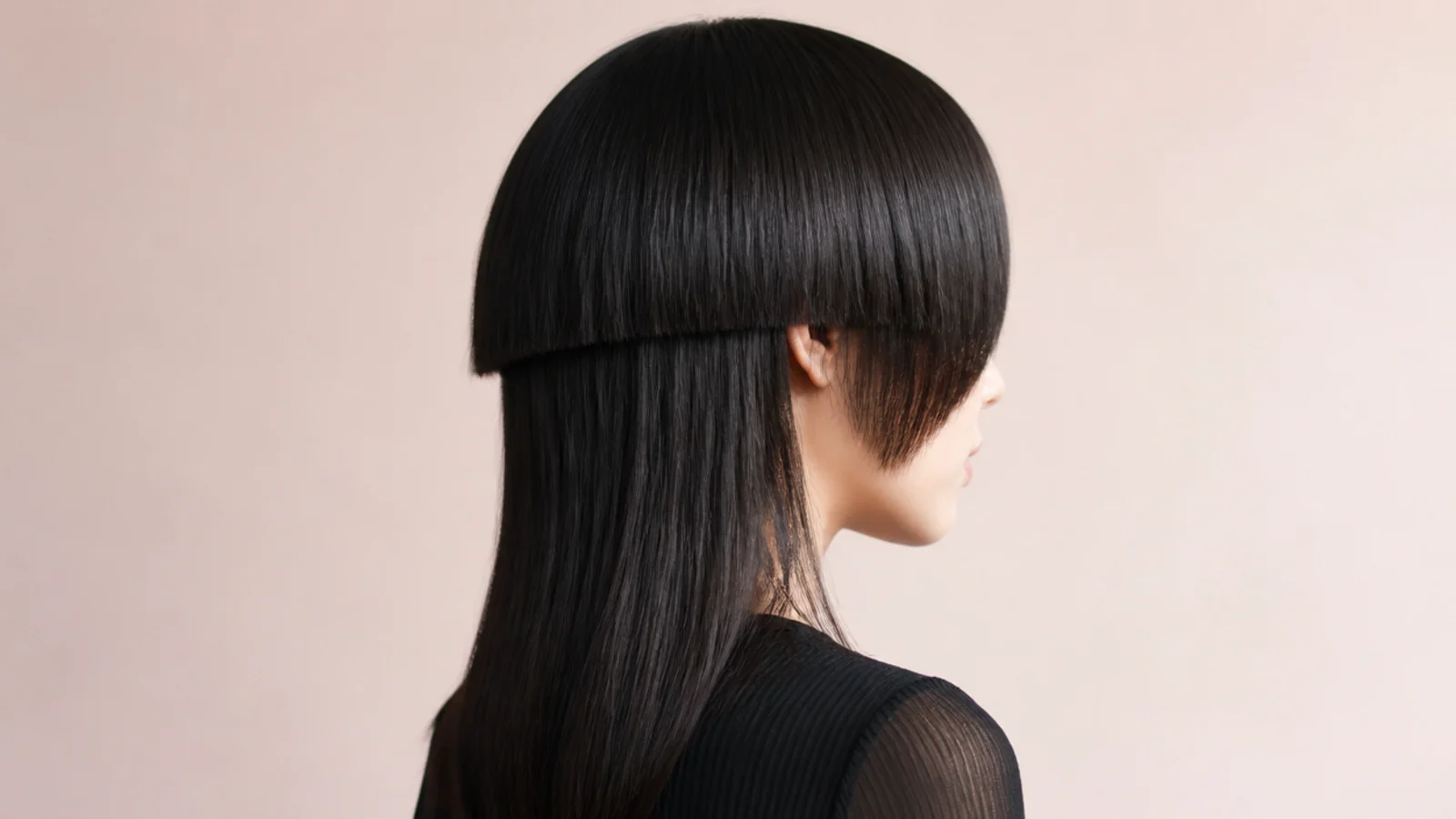 Jellyfish haircut with V-shaped bangs dipping to a point at the center of the forehead