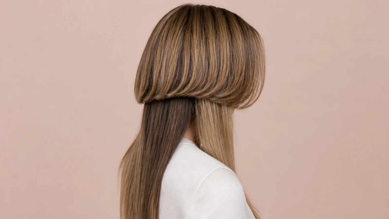 Layered jellyfish haircut with center-parted curtain bangs blending into a cheekbone-height bell