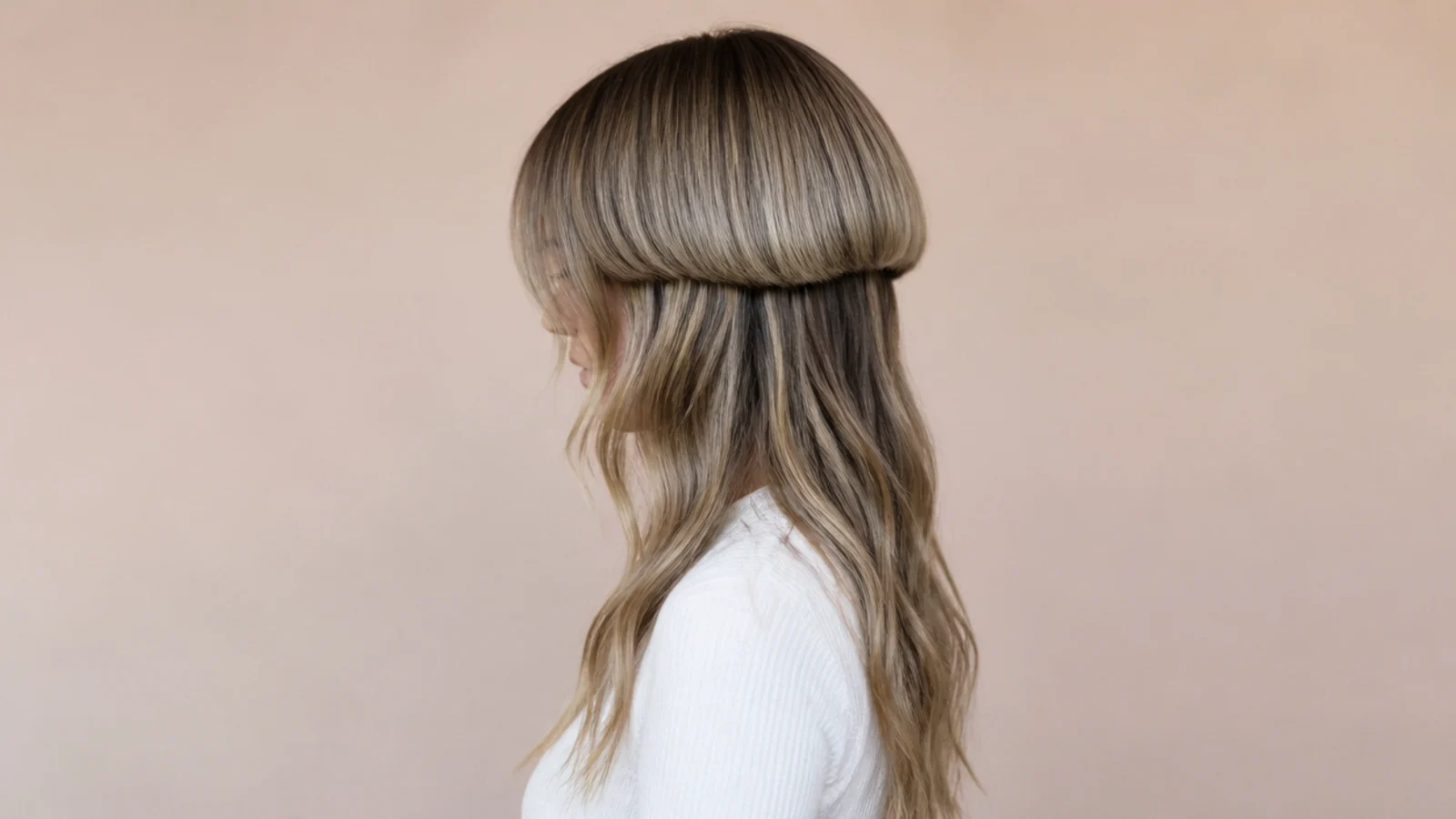 Long wavy jellyfish haircut with soft beach waves through the lower lengths and a smooth bell