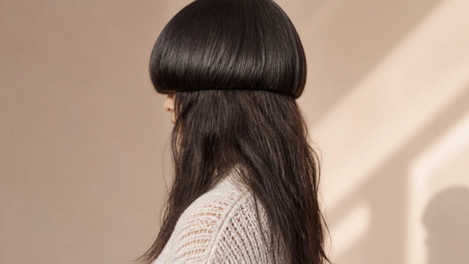 Medium jellyfish haircut on thick coarse dark hair with weight removed from underneath the bell