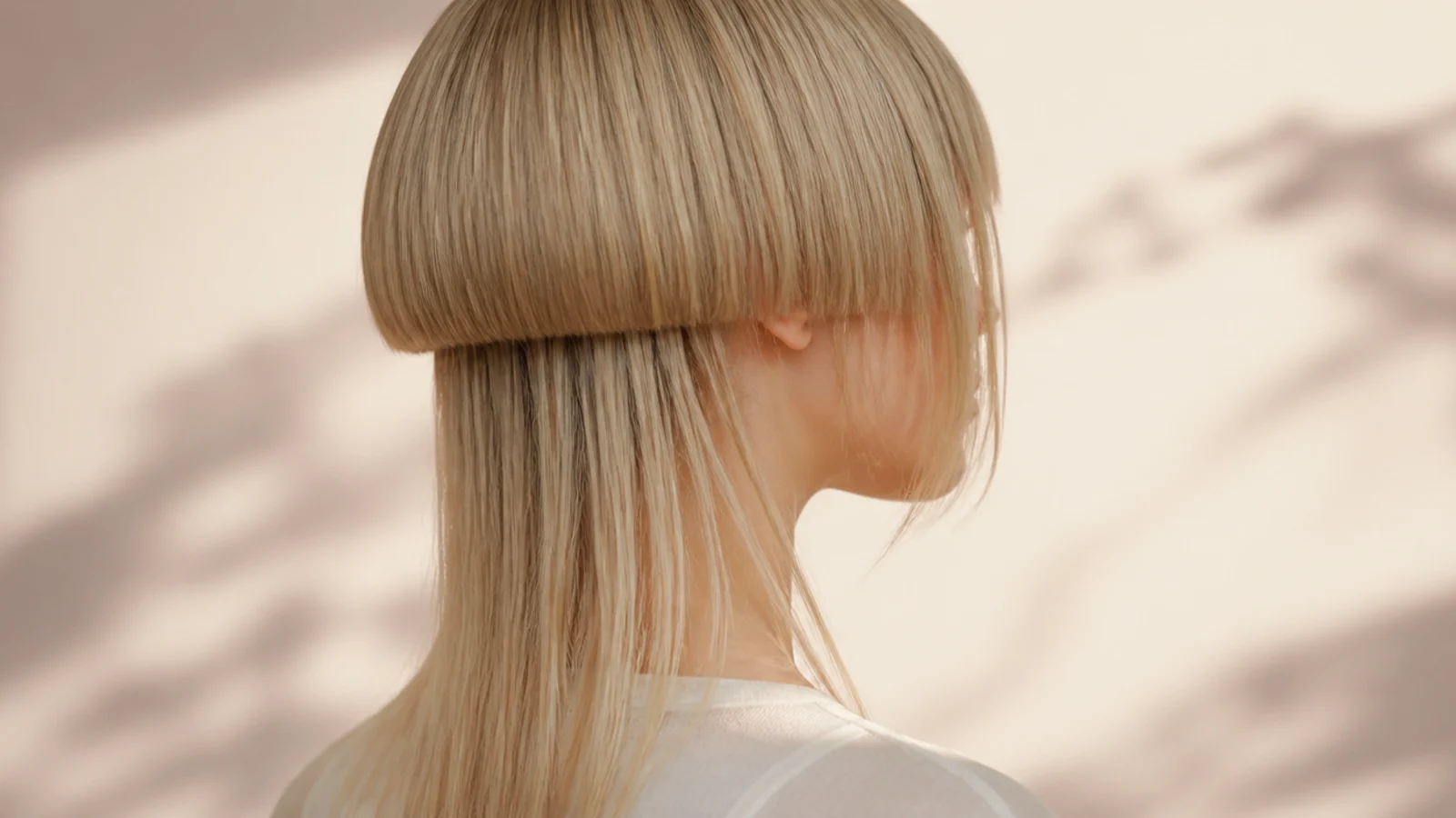 Short jellyfish haircut on fine straight blonde hair with a solid blunt bell and thin lower layer