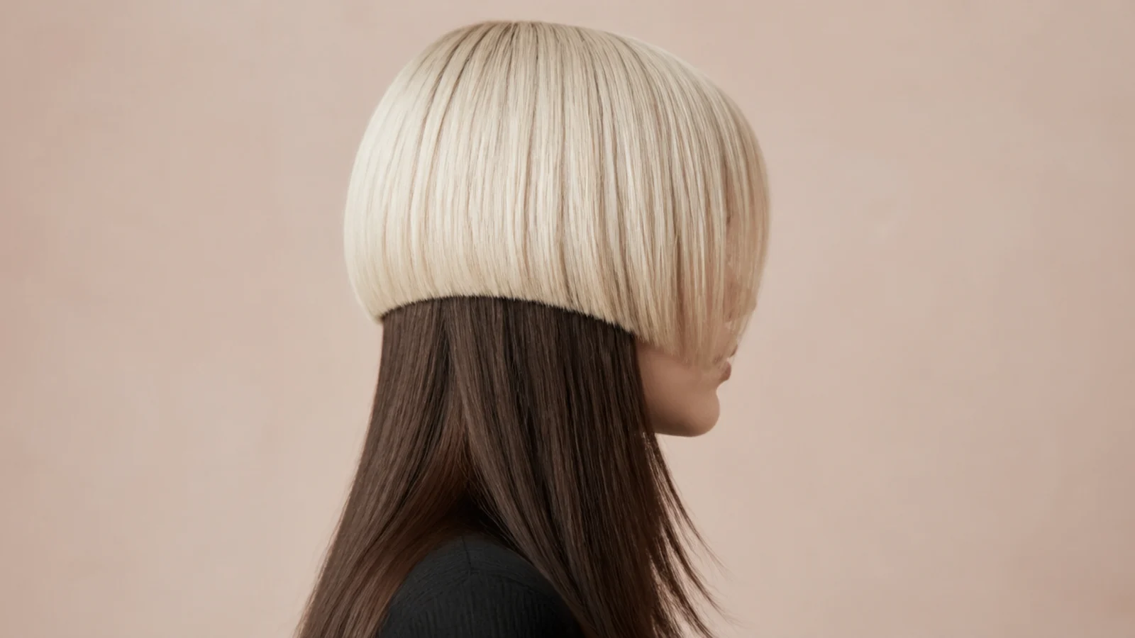 Short jellyfish haircut with a platinum blonde bell over dark brown long lower layer in high contrast