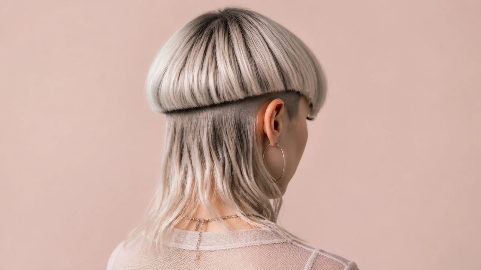 Short jellyfish haircut with a hidden undercut visible beneath the bell when the hair moves