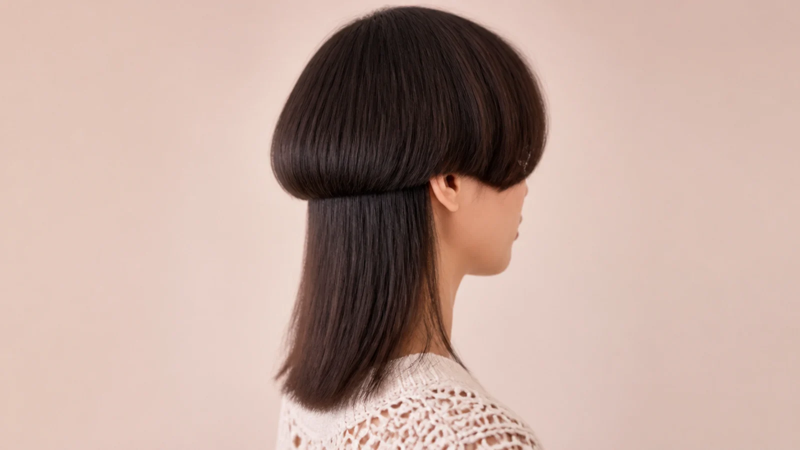 Short jellyfish haircut with an ear length rounded bell over bra strap length straight lower layer