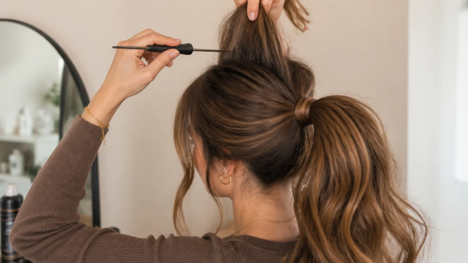 Teasing comb backcombing the underside of a crown section to build high ponytail volume