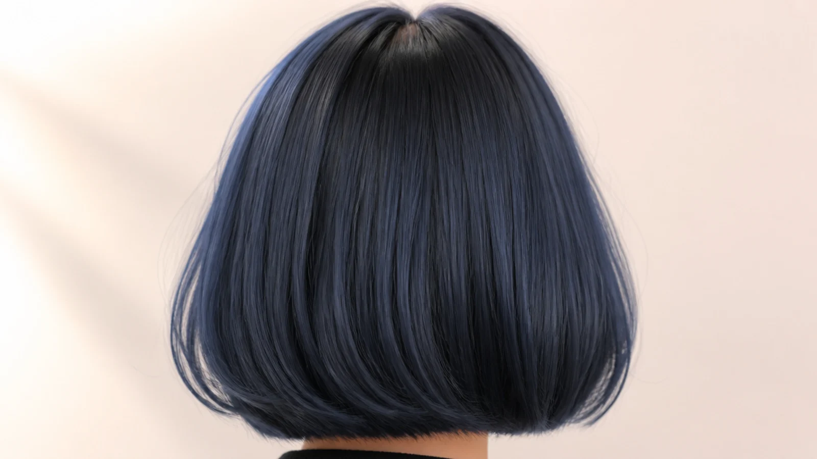 Blue-black chin-length sleek bob with a center part and blunt ends, photographed from behind