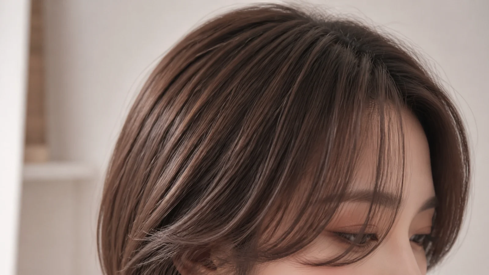 Korean short curtain bangs paired with a layered hush cut falling just below the shoulders