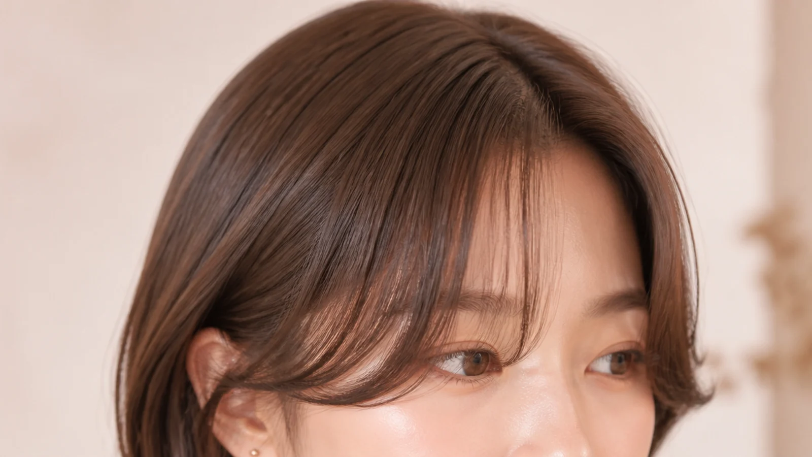 Korean style straight short curtain bangs with feathered ends flicked outward away from the face
