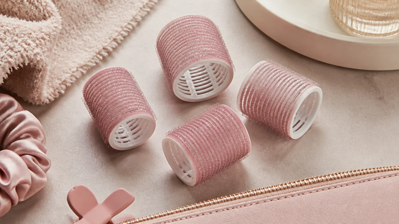 Faceless flat lay of self-gripping velcro rollers for heatless volume and bend