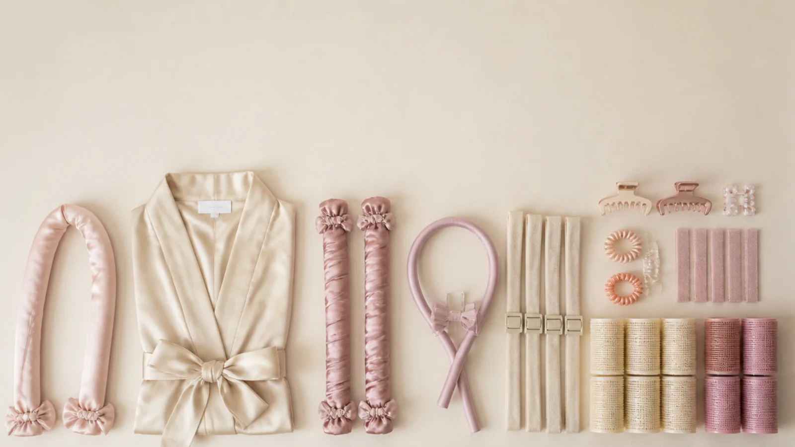 12 heatless curl tools compared, vertical Pinterest style flat lay of a satin rod, curling robe and foam rollers