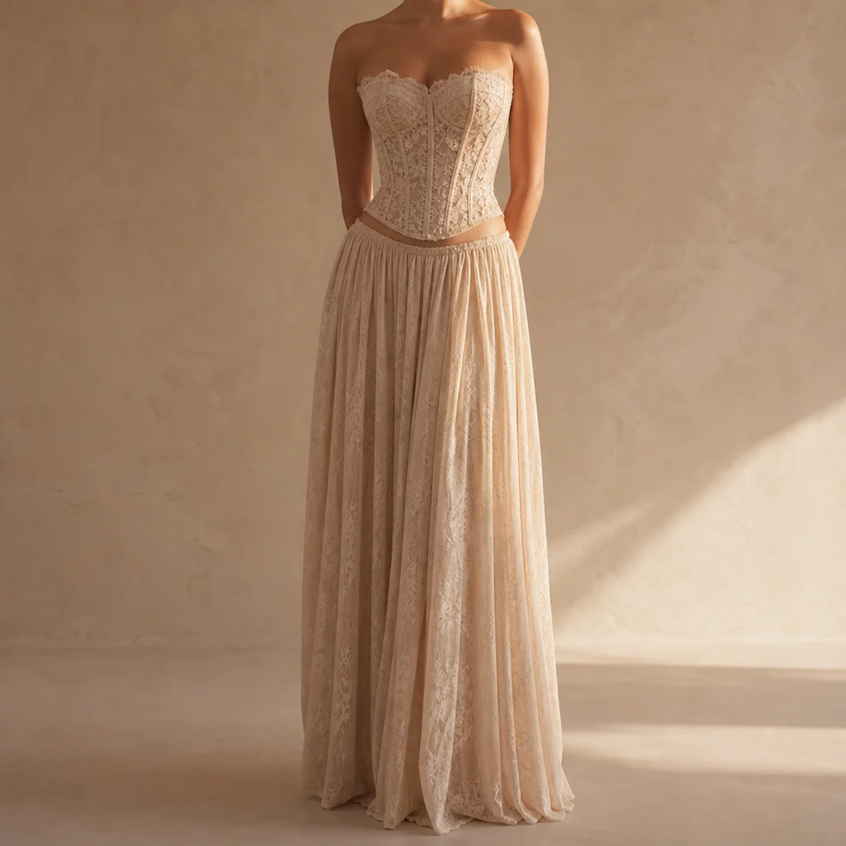 Faceless full-length shot of a lace corset top with a flowing maxi skirt