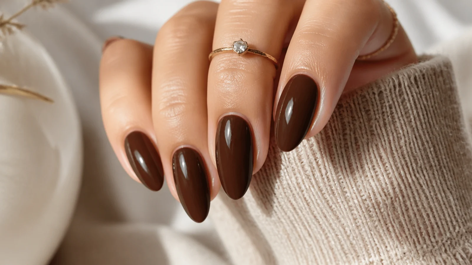 Medium chocolate brown almond nails in a rich espresso shade with a glossy taper