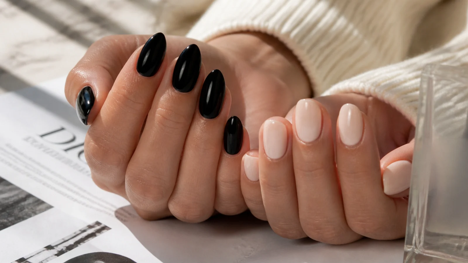 Almond nails in glossy black beside oval nails in milky nude showing how finish reads on each shape