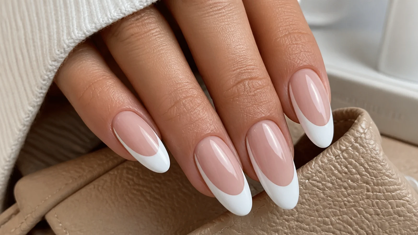 Long oval nails with a deep wide white french tip curving high up the sidewalls