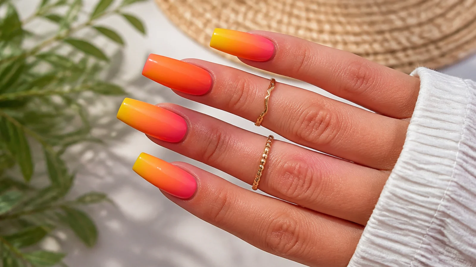 Long coffin sunset ombre summer nails blending yellow into orange into hot pink