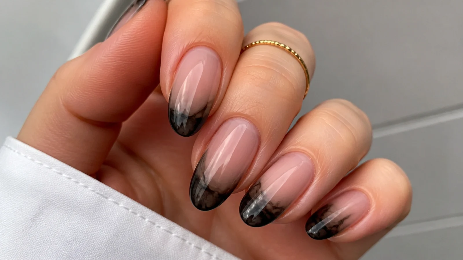 Black blooming gel French tips with softly diffused edges