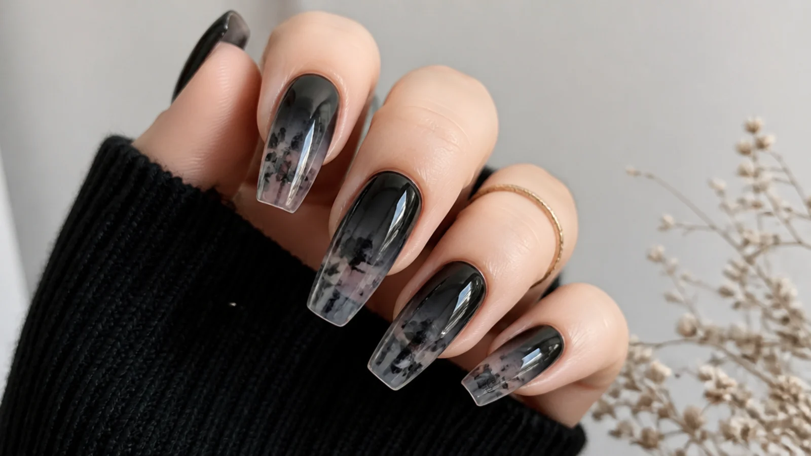 Black to clear ombre blooming gel nails with a soft graduated fade