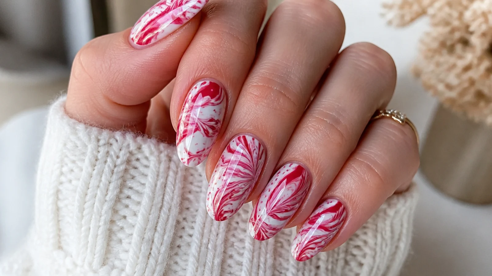 Red and white candy cane marble blooming gel nails