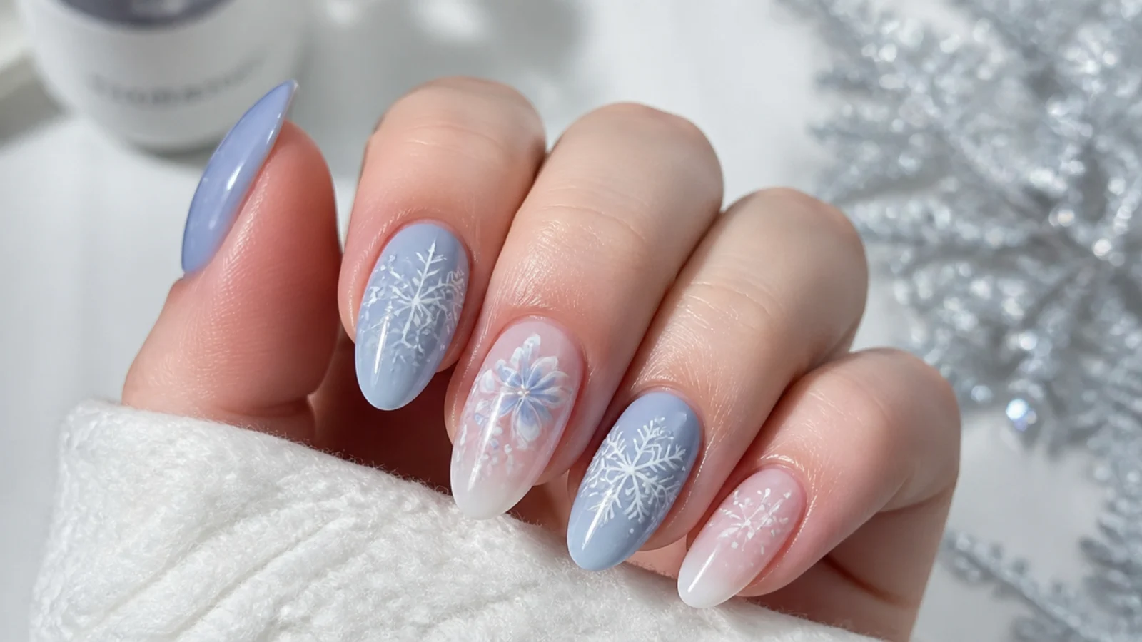 Soft blue and white snowflake blooming gel nails