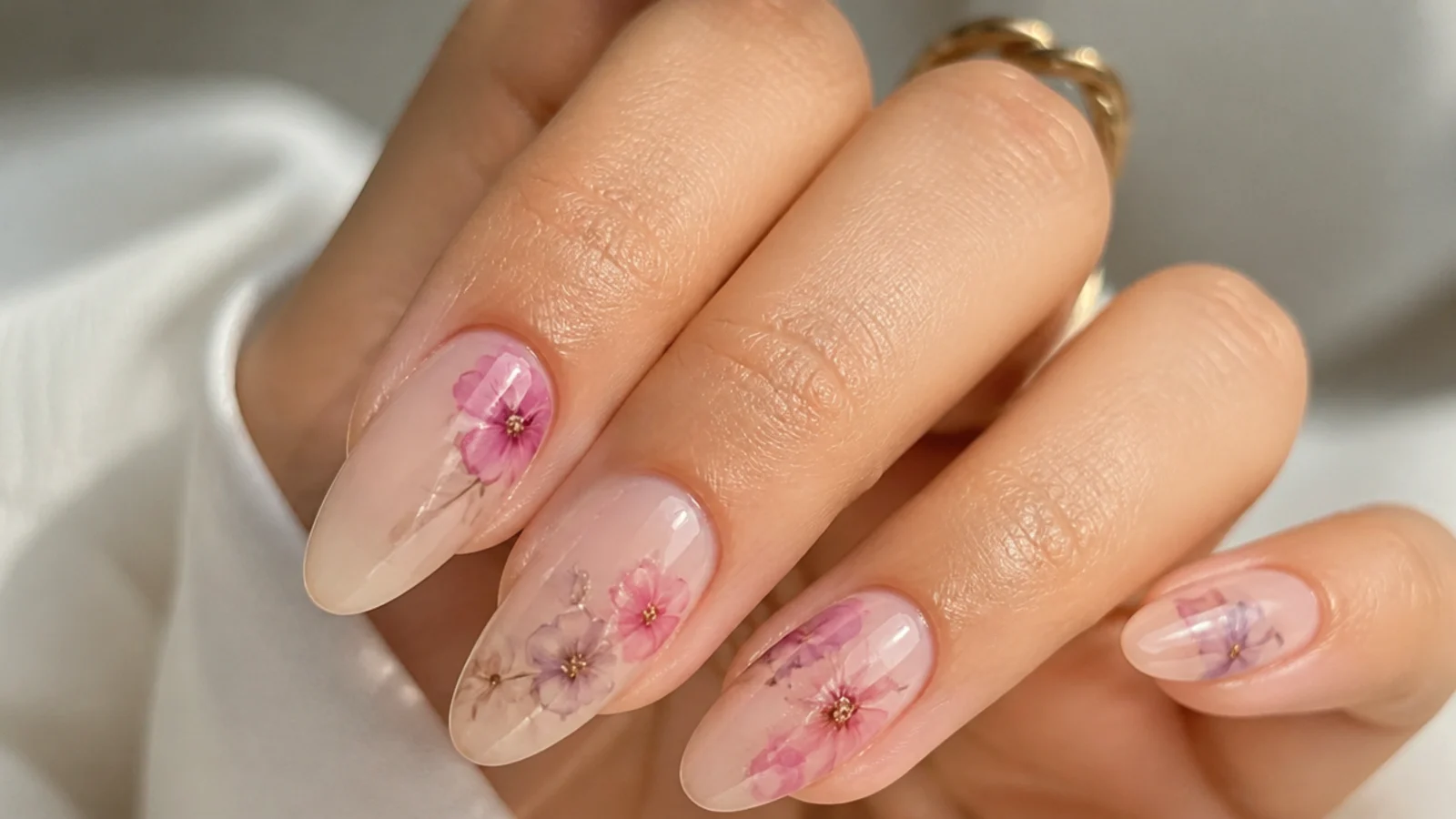 Soft watercolor flower nails made with clear blooming gel over a nude base