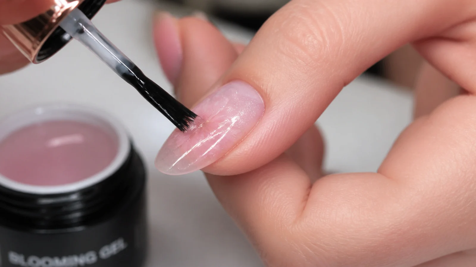 Clear blooming gel being brushed over a cured color base before adding flower color