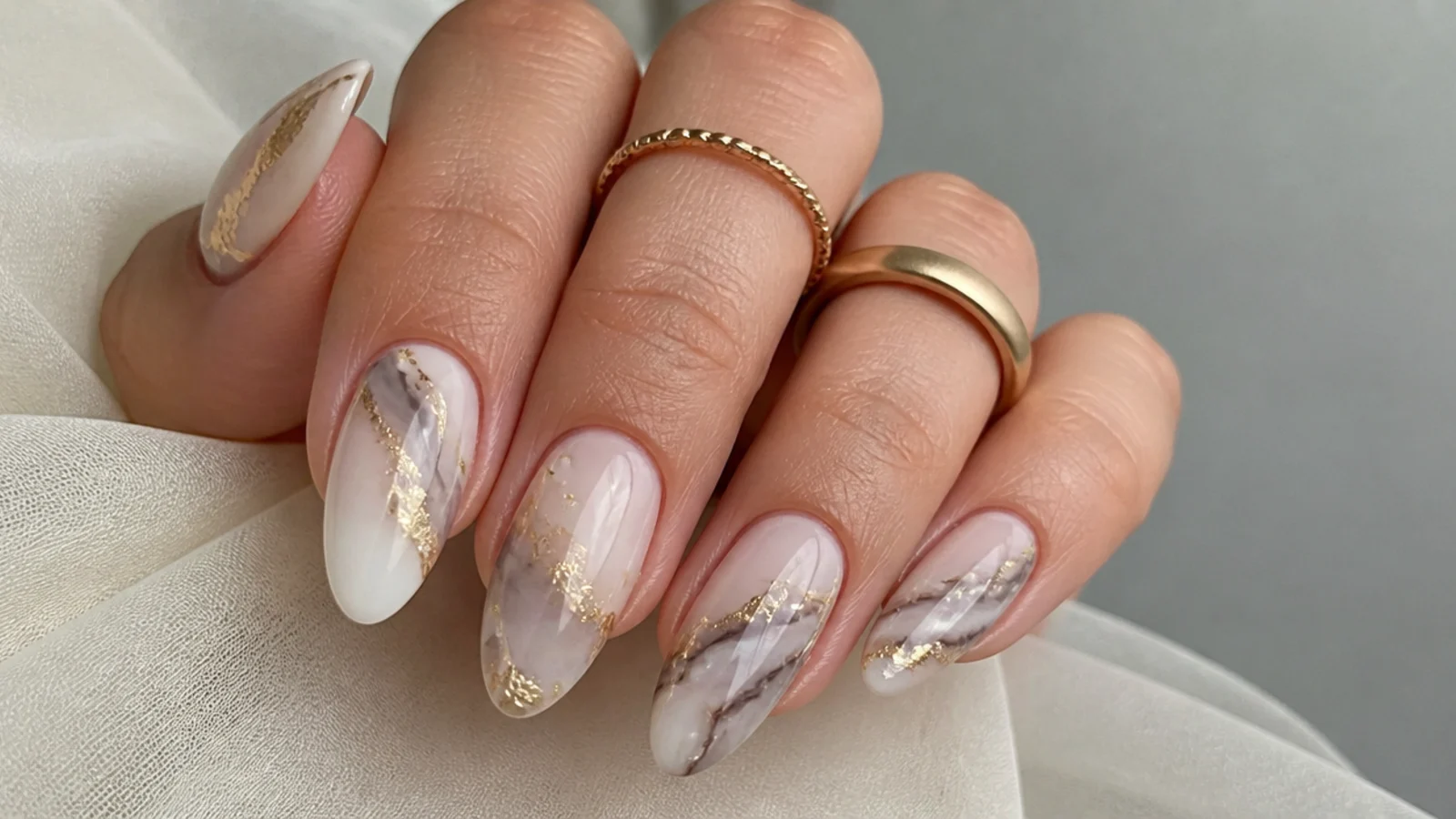 Cream and gray marble blooming gel nails with gold foil veins