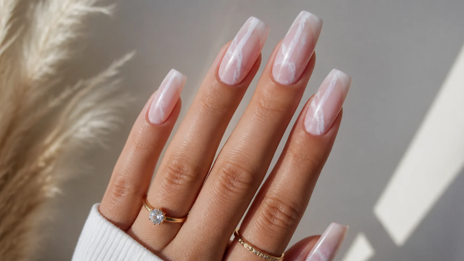 Coffin nails with pale pink and white marble veins in blooming gel
