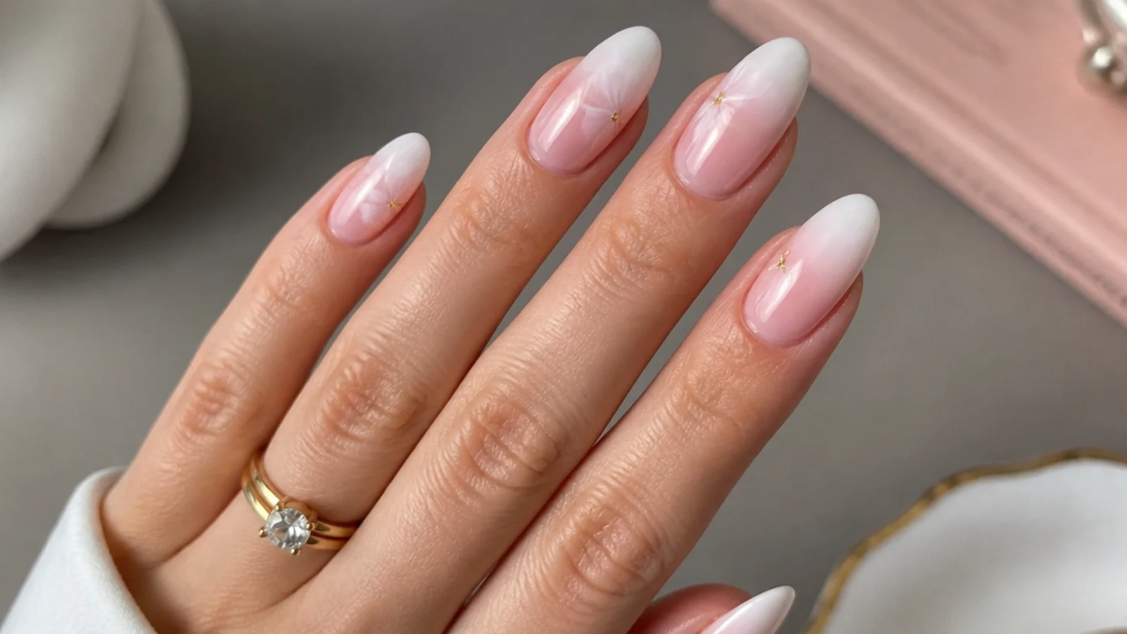 Almond nails with a soft white blooming gel diffused French tip