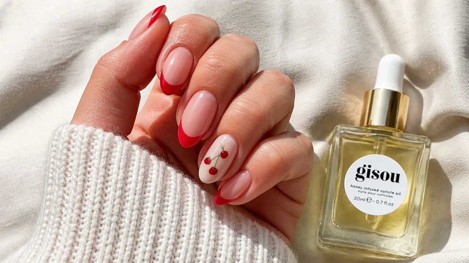 Cuticle oil beside a fresh blooming gel manicure for maintenance