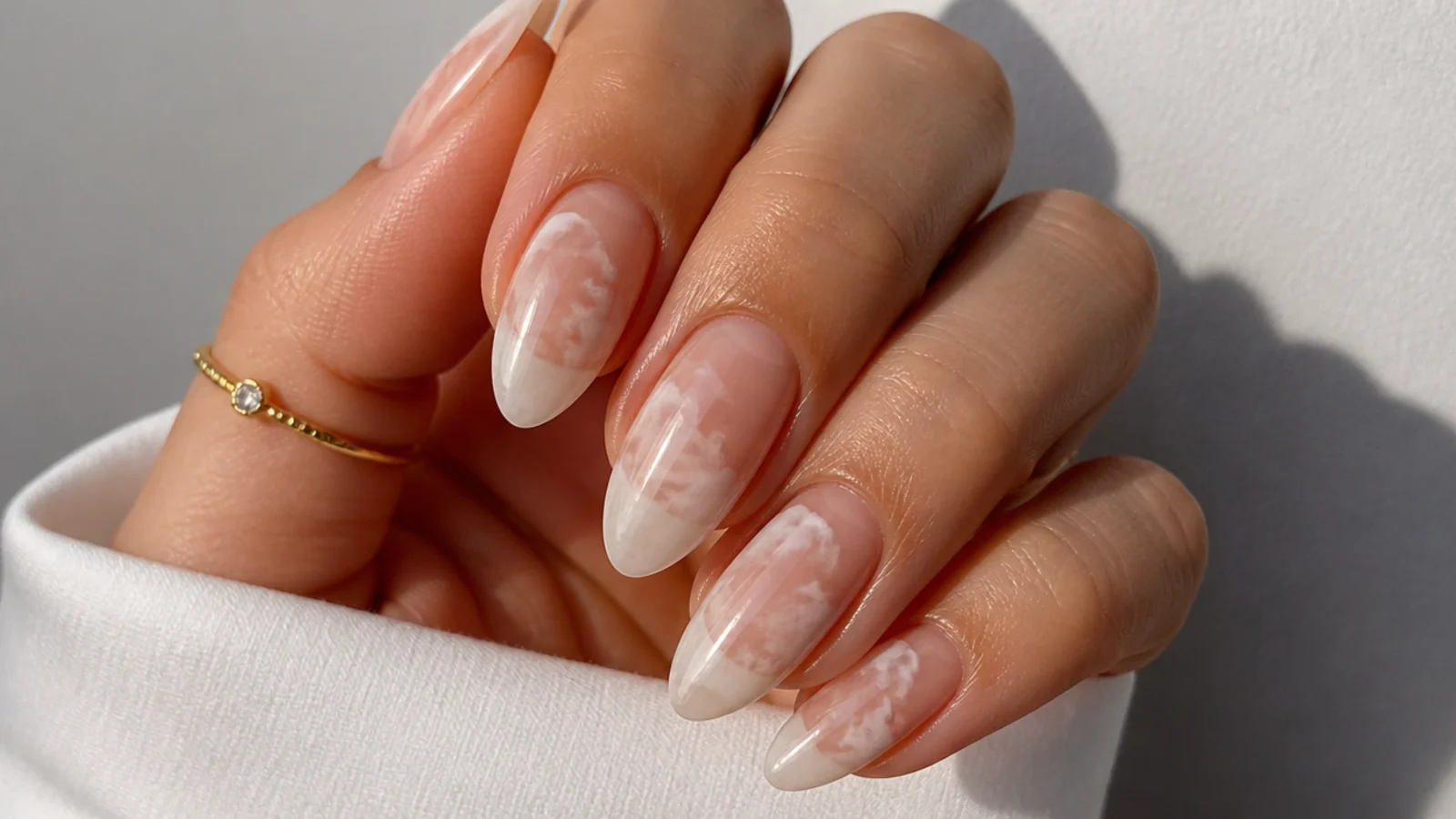 Soft white cloud diffusion blooming gel nails on a nude base