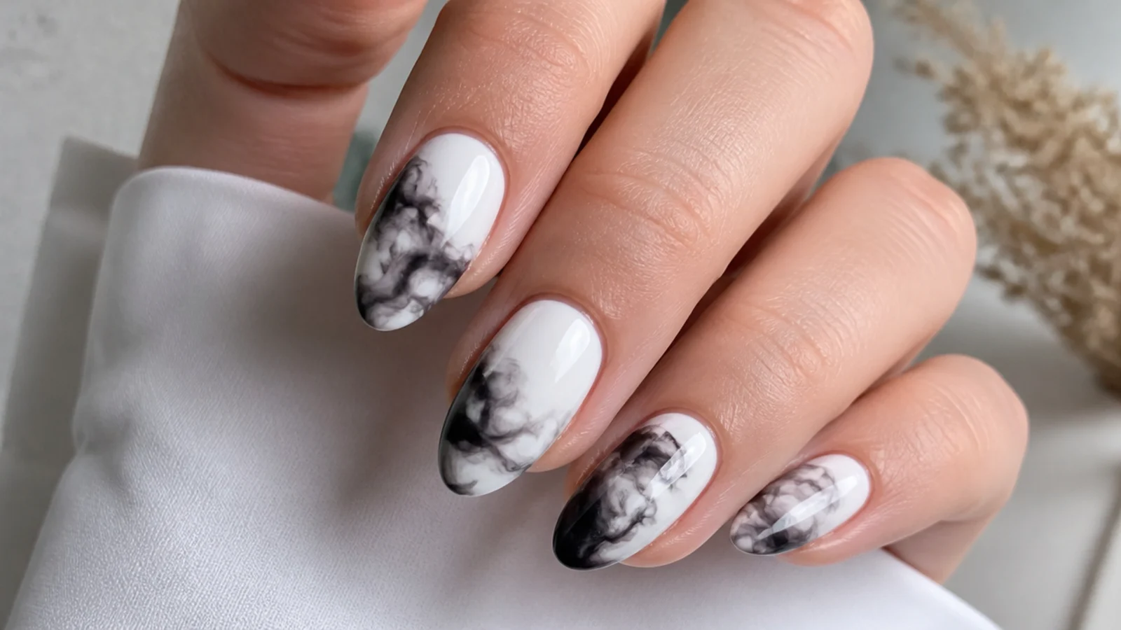 Black ink diffusion blooming gel nails on white with smoky edges