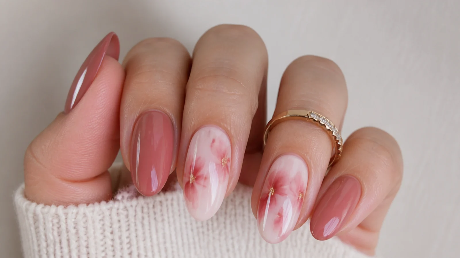 Soft diffused blooming gel design beside a crisp painted gel design
