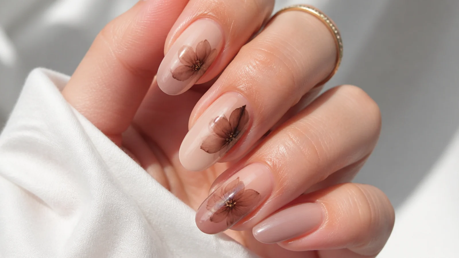 Toffee and cocoa flower blooming gel nails with soft diffused petals