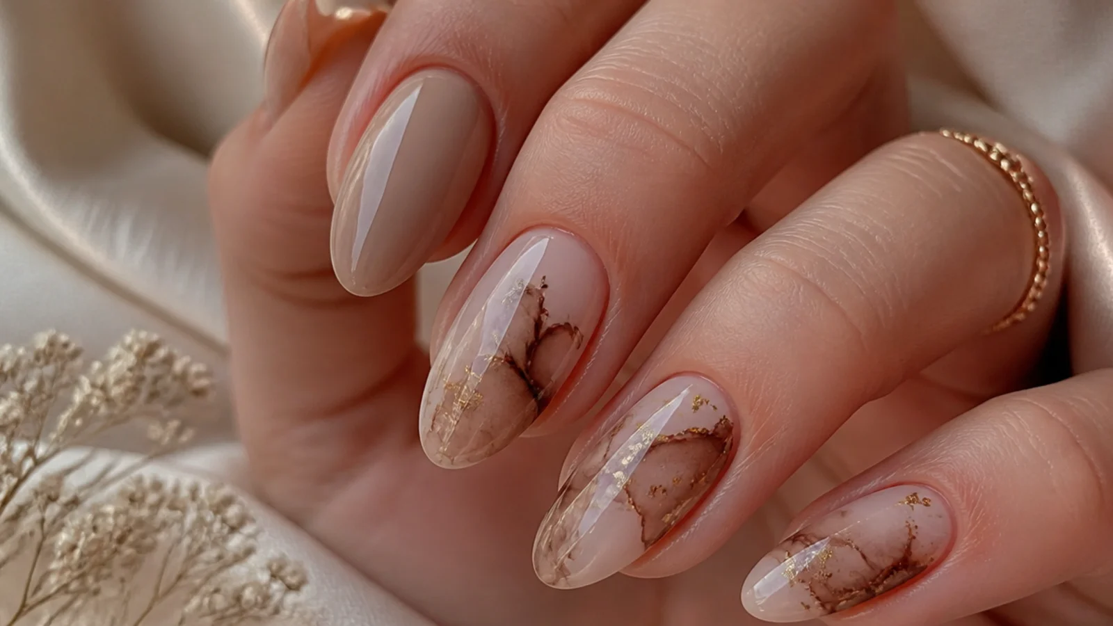 Close-up of brown gel color spreading into a soft watercolor bloom