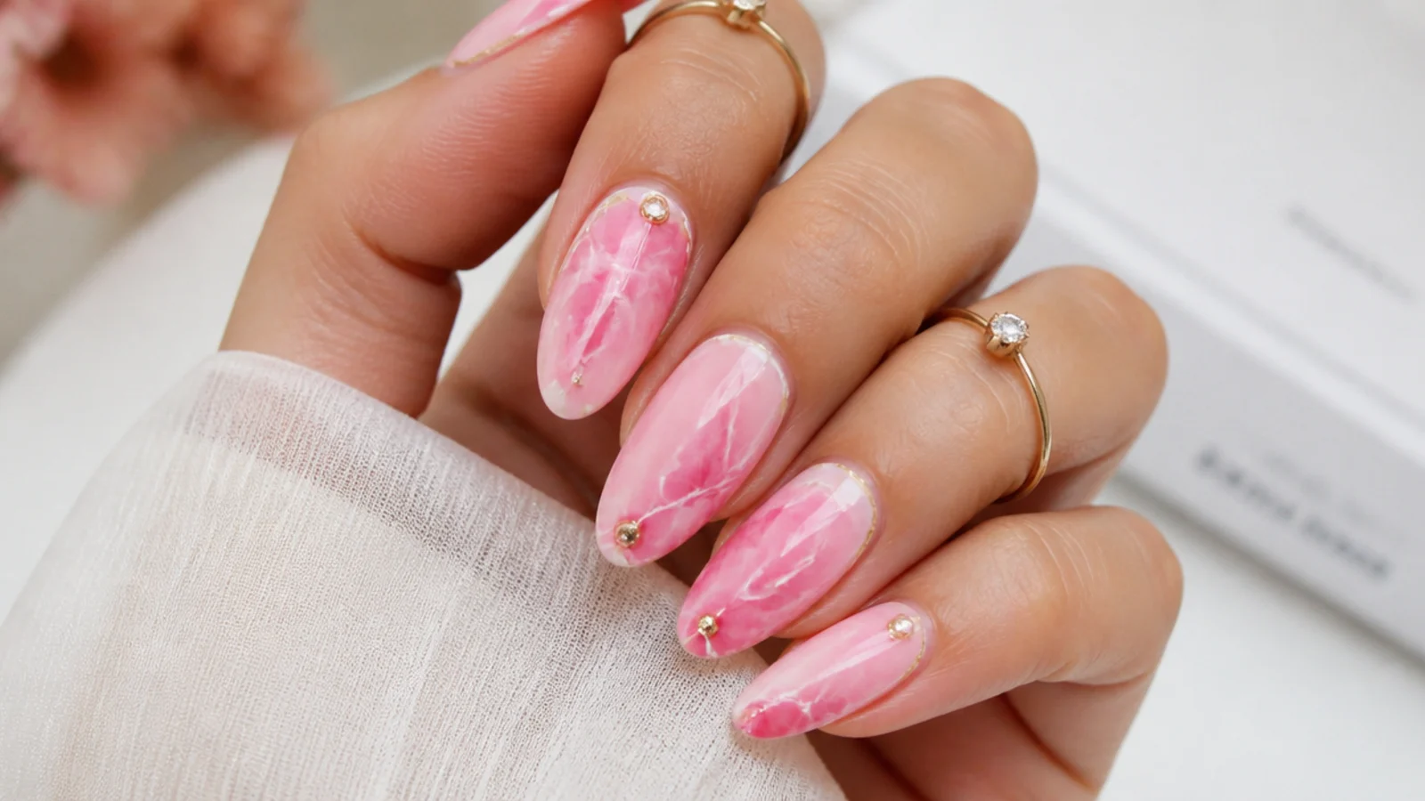 Blooming gel nails with hot pink and white marble veining