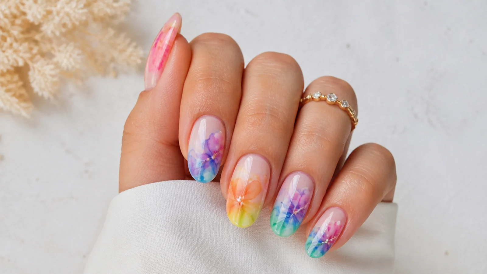 Bright rainbow blooming gel nails with soft diffused watercolor color