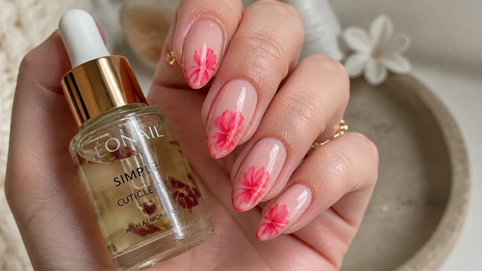 Cuticle oil and a gel-manicured hand showing a lasting bright bloom