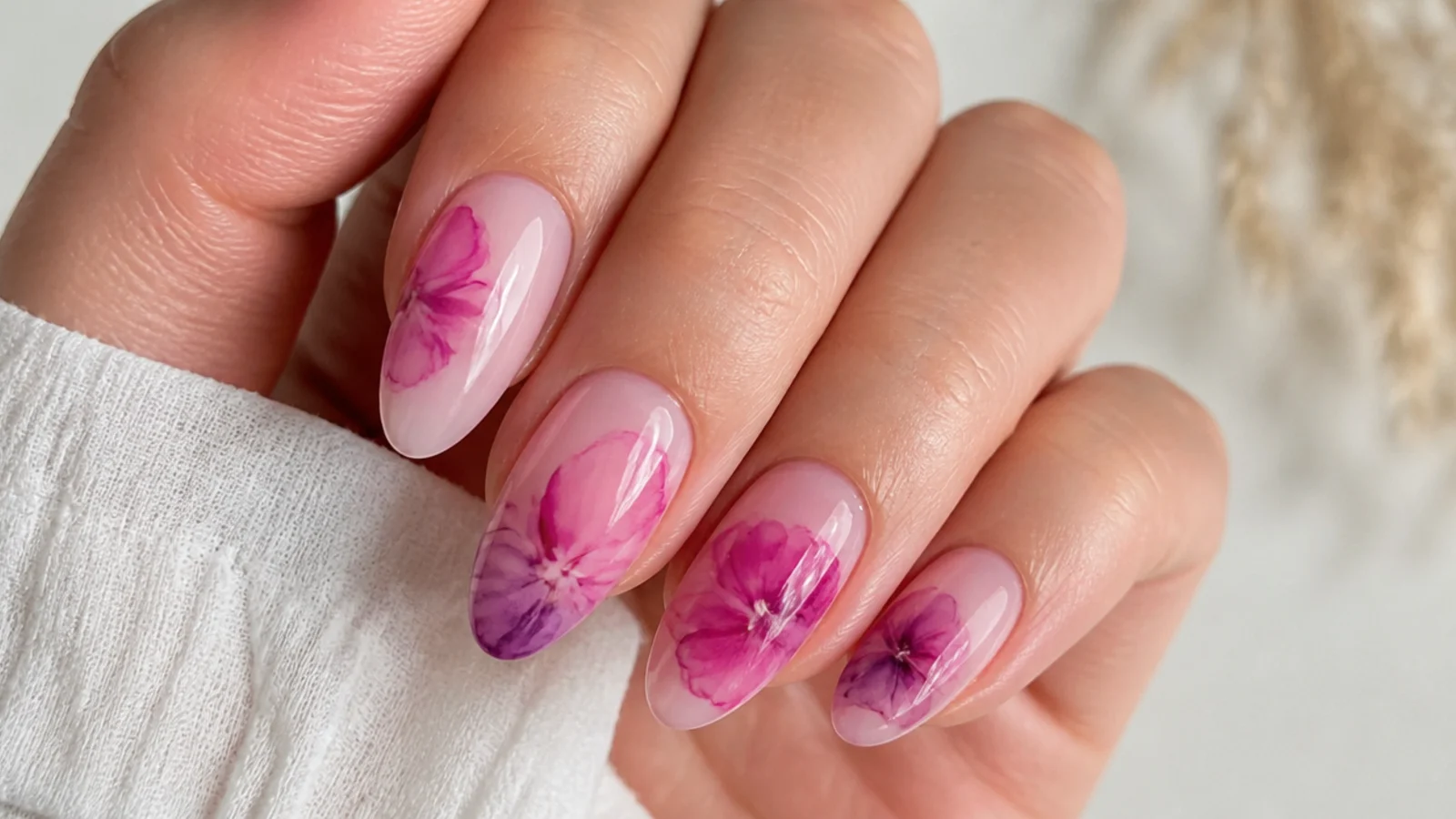 Close-up of gel color diffusing into a soft watercolor bloom