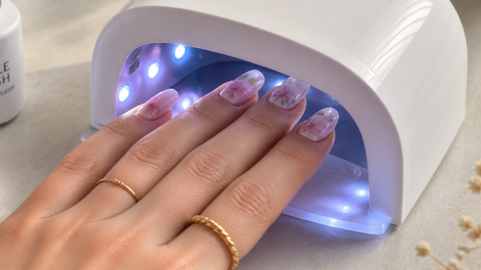 A finished watercolor bloom being cured under an LED lamp