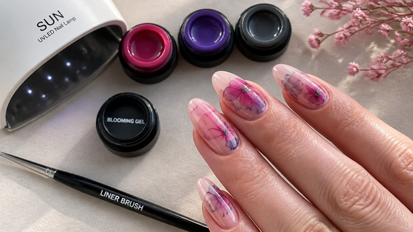 Blooming gel supplies laid out - gel colors, blooming gel, lamp and liner brush