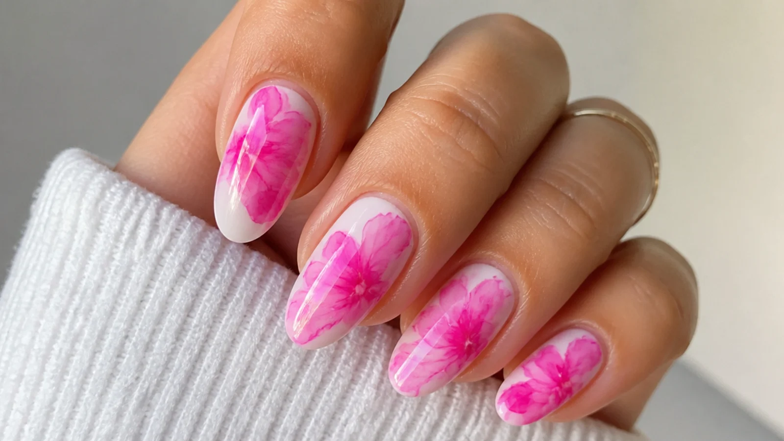 Hot pink ink drop blooming gel nails on a white base