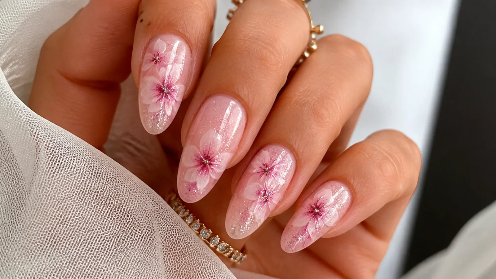 Pink blooming gel nails with fine glitter over the bloom