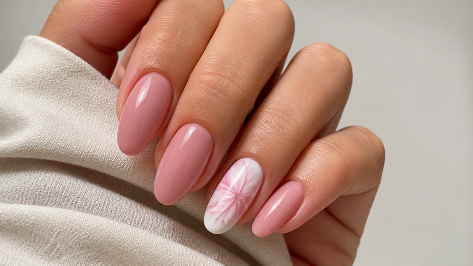 Soft pink nails with one abstract blooming gel accent nail
